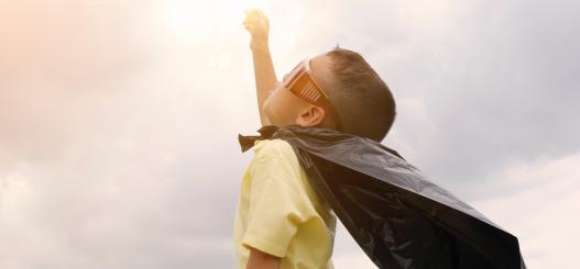 boy dressed as a superhero